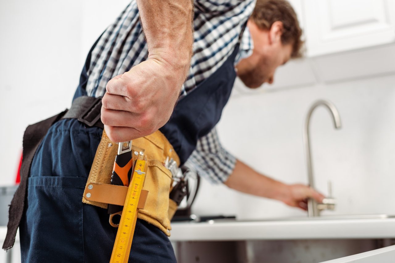 Plumber repairing a gas boiler in Astoria, NY<br>